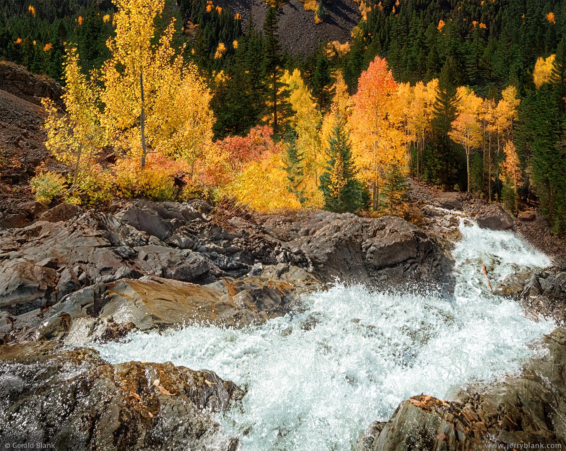 #07133 - The Uncompahgre River splashes down a colorful canyon as it flows toward Ouray, Colorado - photo by Jerry Blank