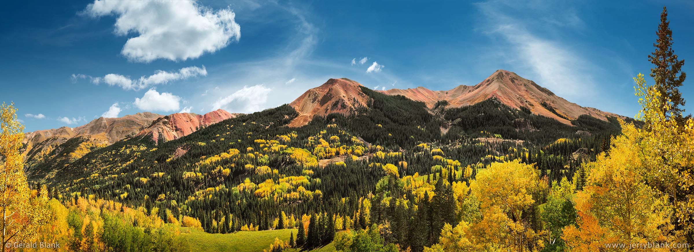 #45420 - An autumn aspen panorama of the three “Red Mountains” in Colorado, north of Red Mountain Pass in the San Juan Mountains. The Idorado Mine is visible at the base of the mountains - photo by Jerry Blank