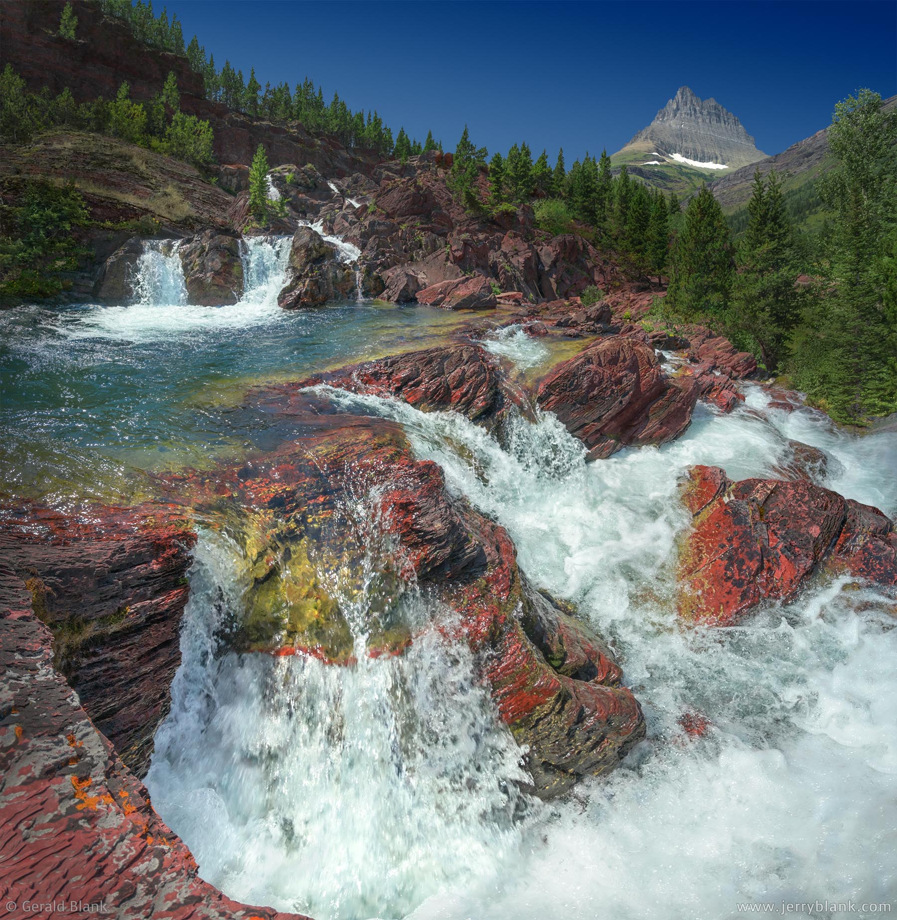 #68679 - Redrock Falls on Swiftcurrent Creek, Glacier National Park, Montana. Mount Wilbur is visible in the background. Photo by Jerry Blank.