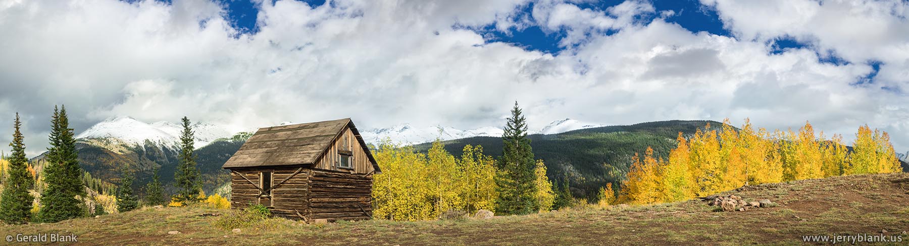 #52109 - Log cabin and autumn foliage alongside a trail in the San Juan National Forest in Colorado - photo by Jerry Blank