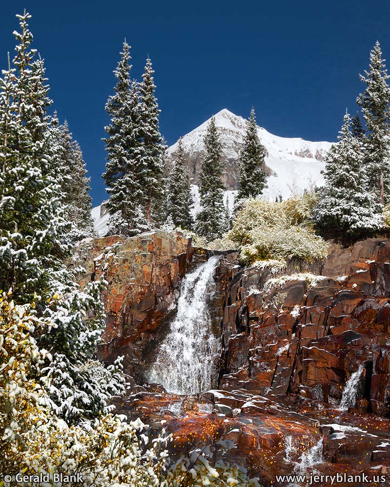#06612 - Fresh snow covers autumn foliage around a waterfall on Sneffels Creek, in Yankee Boy Basin, Colorado, with Cirque Mountain in the background