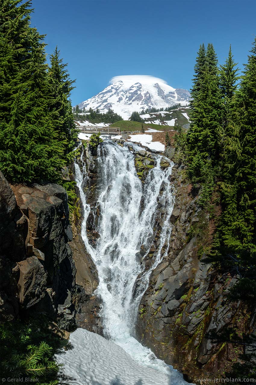 #31763 - The peak of Mount Rainier can be seen between the trees surrounding Myrtle Falls on Edith Creek, in Mount Rainier National Park, Washington - photo by Jerry Blank